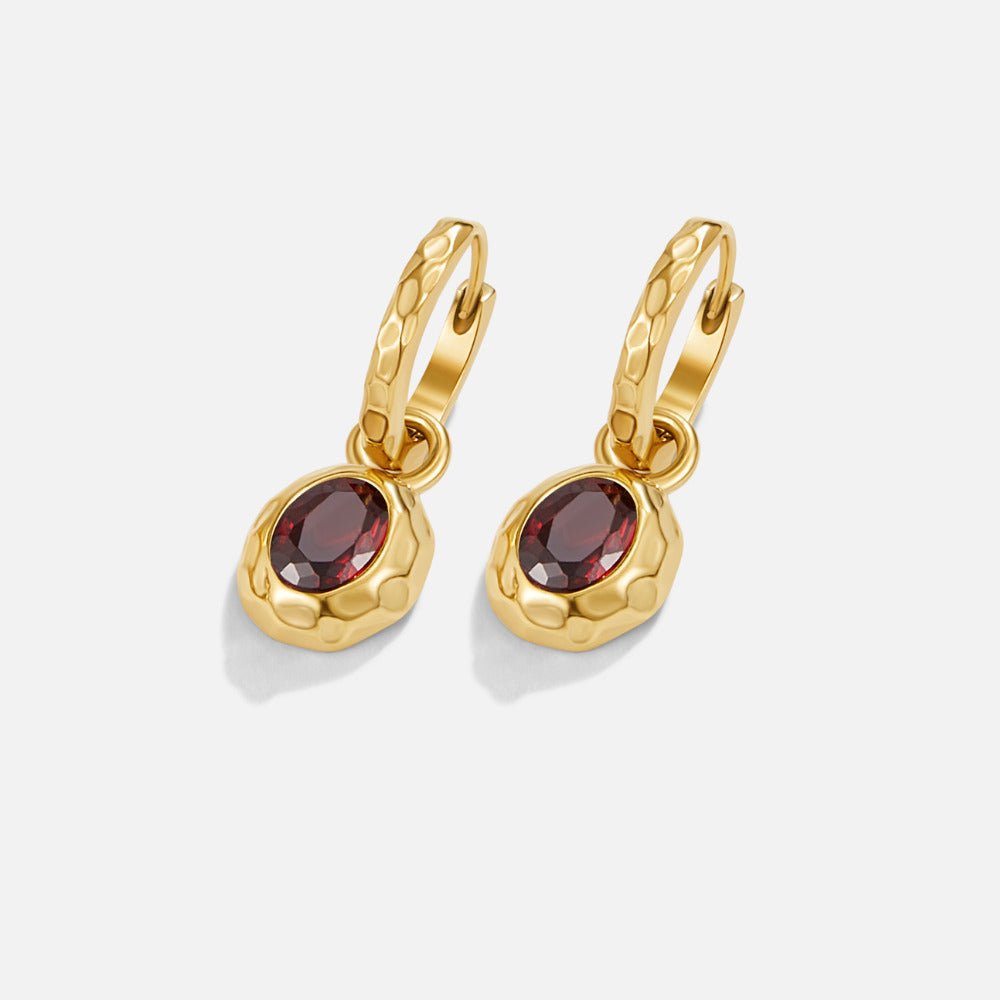 Vintage Garnet Hoop Earrings, pair of gold hoops with hammered texture and dark red oval stones