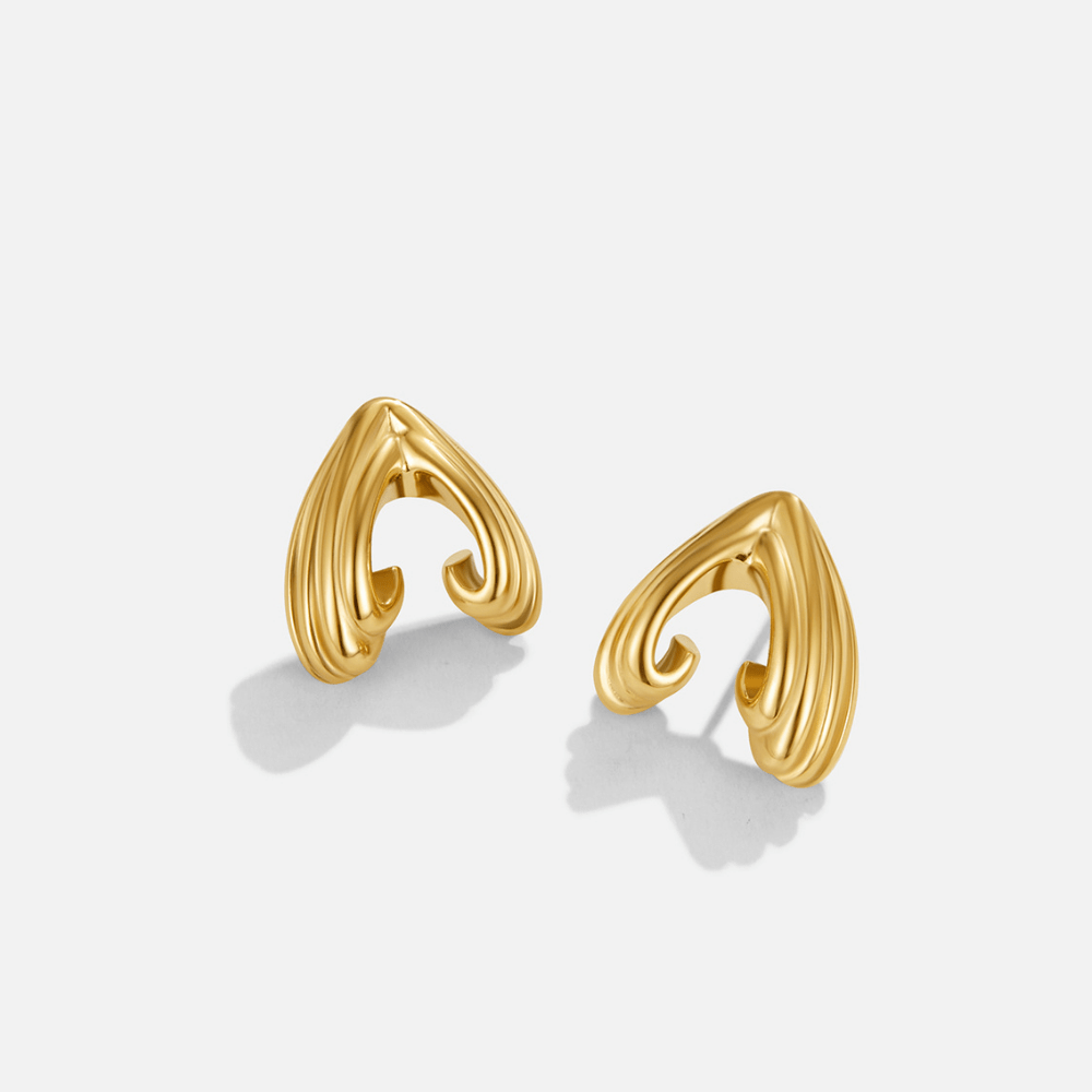 Vintage Olivia Gold Earrings, pair of gold earrings on white background, ridged swirl design