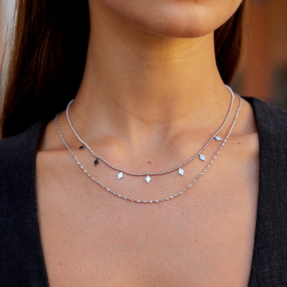 Willow Diamond Drop Layered Necklace, worn as two layered chains with diamond-shaped drops