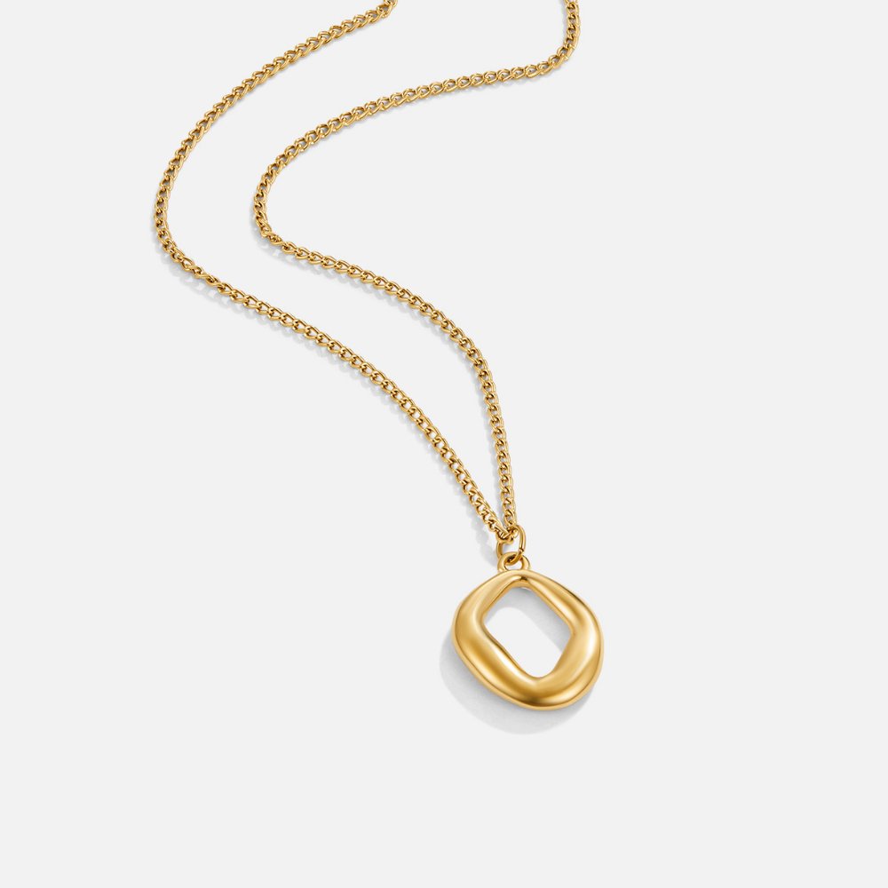 Zola Geometric Gold Necklace, gold chain necklace laid flat with an open, organic pendant