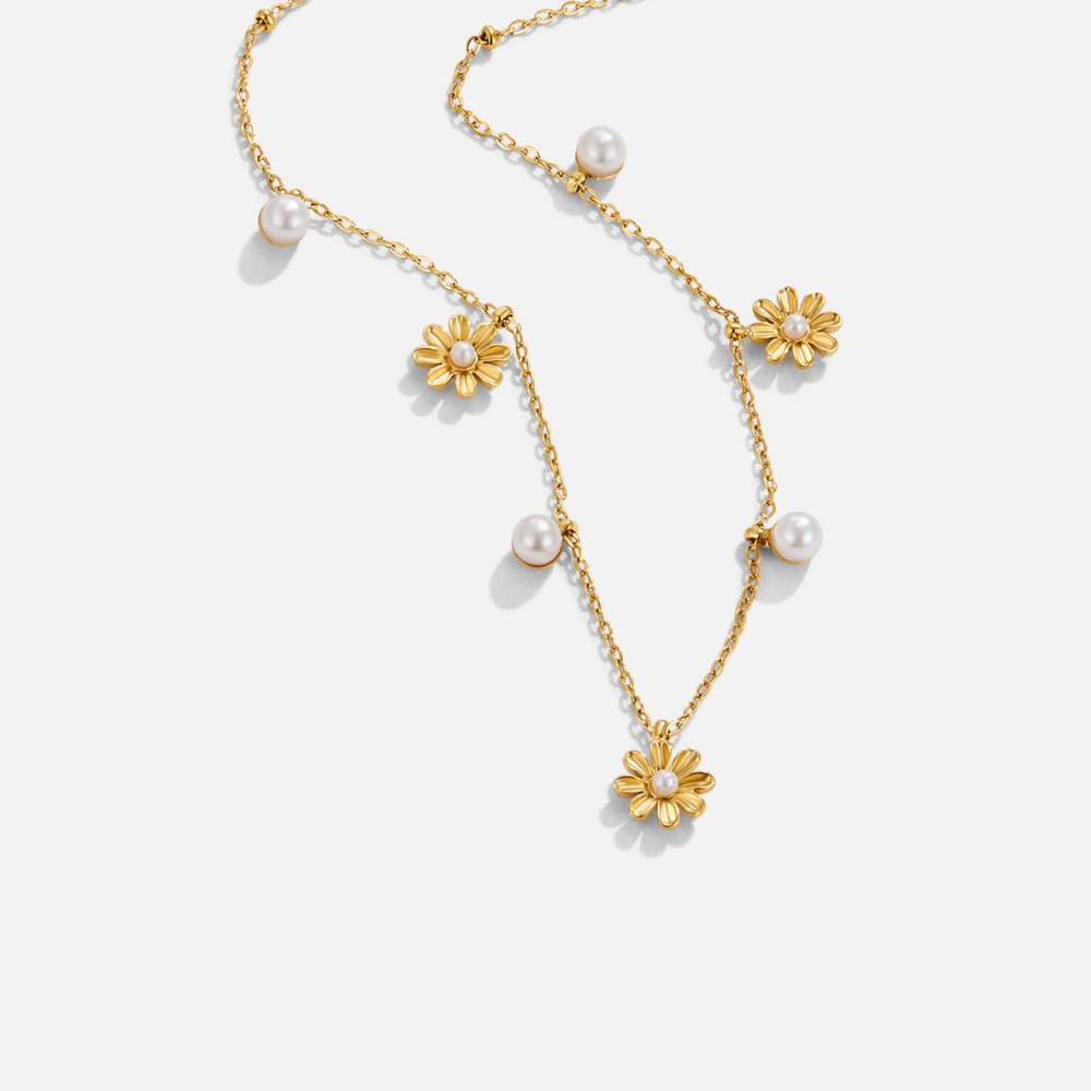 Autumn Flower & Pearl Necklace, gold chain necklace laid flat with daisy and pearl charms