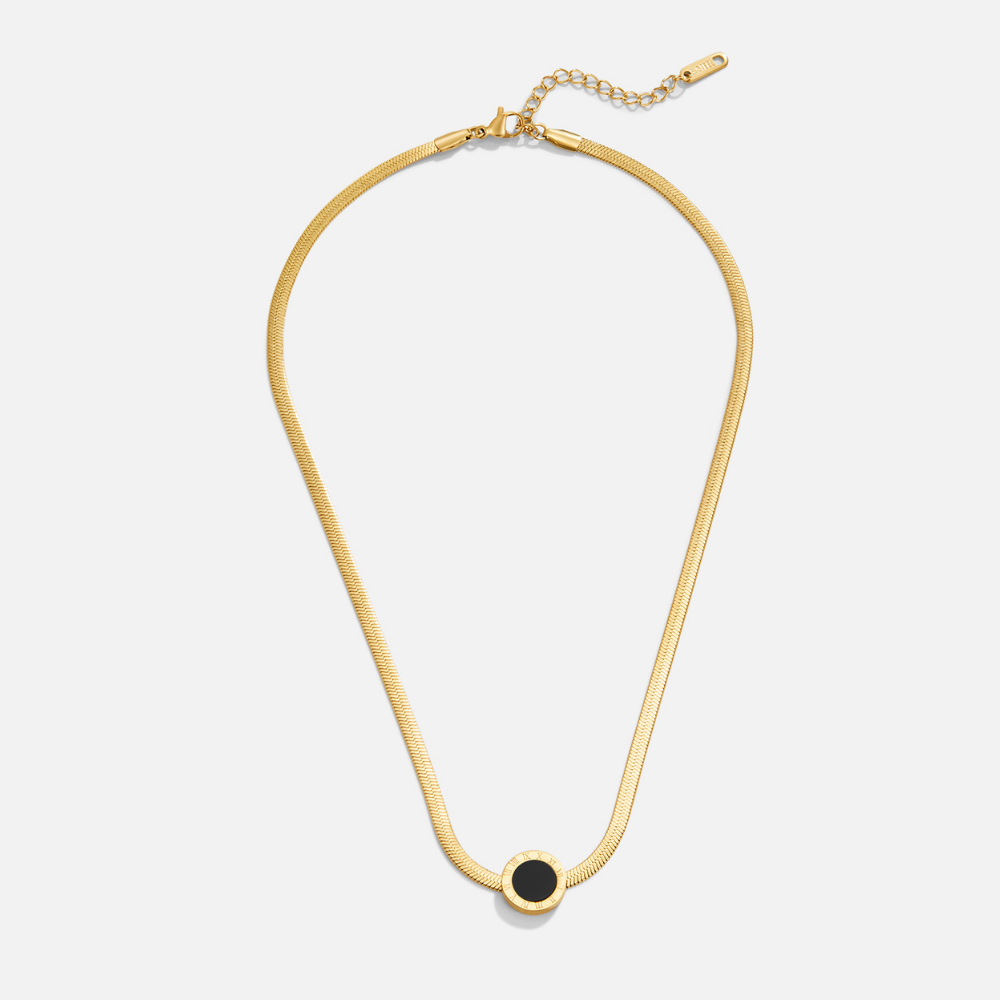 Azalea Black Pendant Necklace, flat lay of a gold herringbone chain with a round black pendant