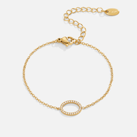 Kaia Round Crystal Bracelet, laid flat on white, gold chain with crystal open circle