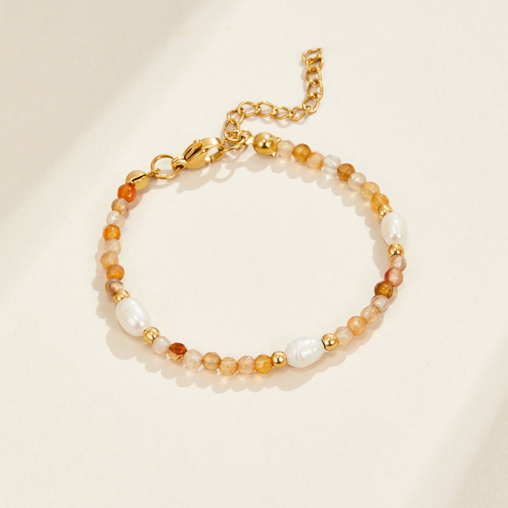 Agate & Pearl Bead Bracelet, laid flat on cream surface, orange agate beads with pearls and