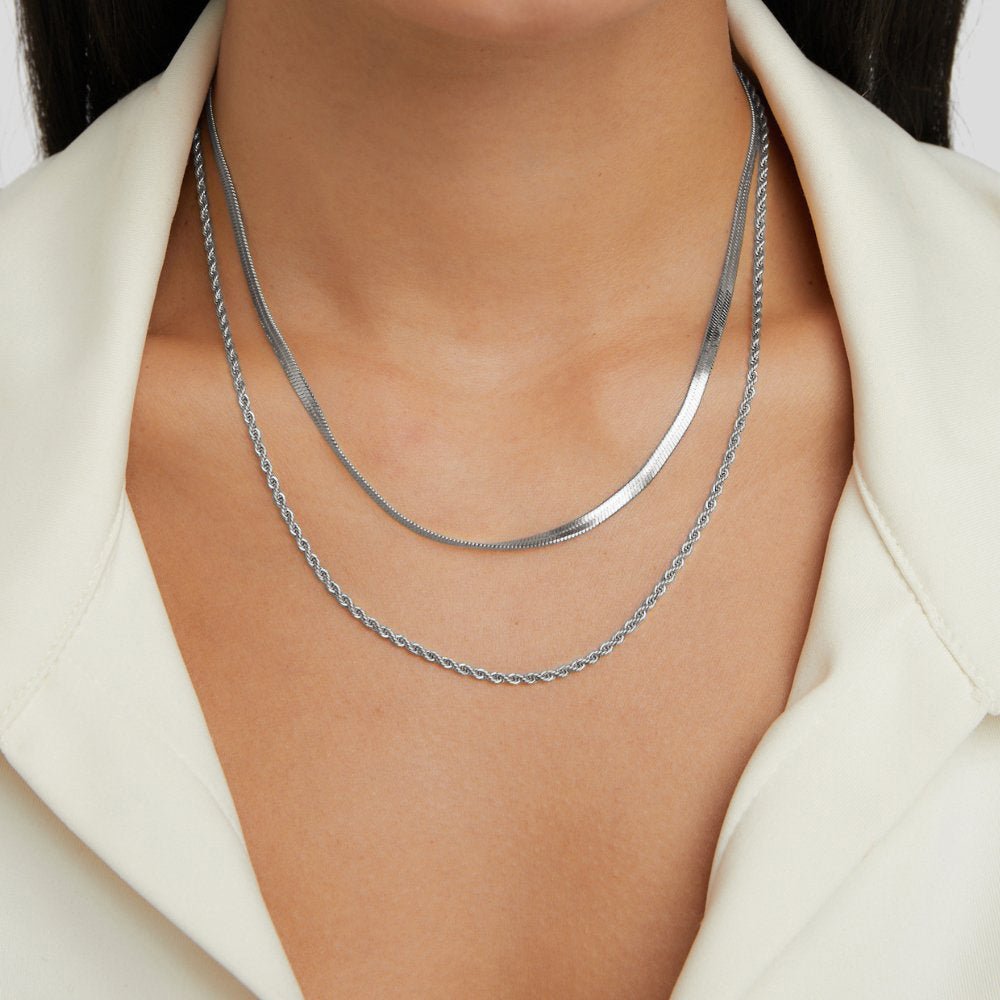 Alexandra Silver Layered Necklace, worn layered on a neck with a cream collared top