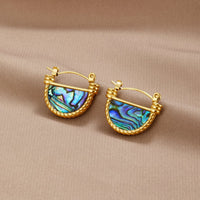 Amalfi Turquoise Shell Earrings, a pair of gold hoops with iridescent blue abalone shell