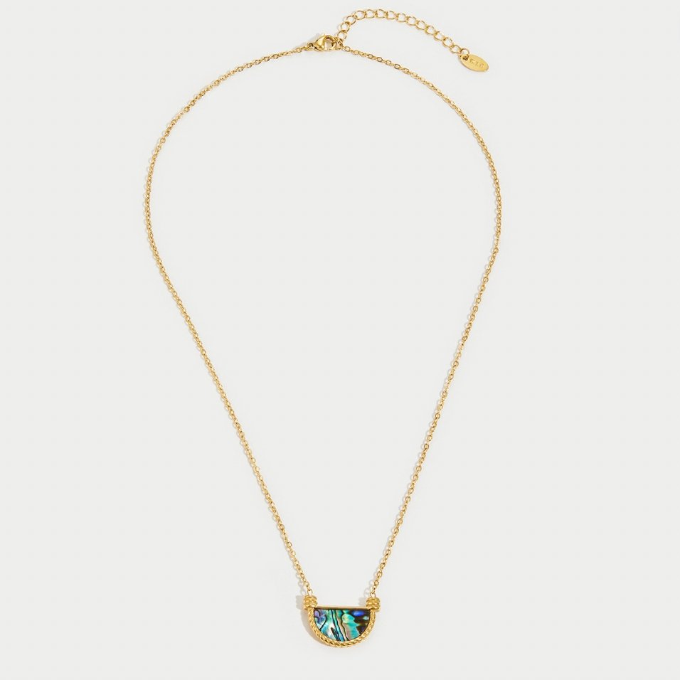 Amalfi Turquoise Shell Necklace, flat lay of a gold chain with a half-moon shell pendant