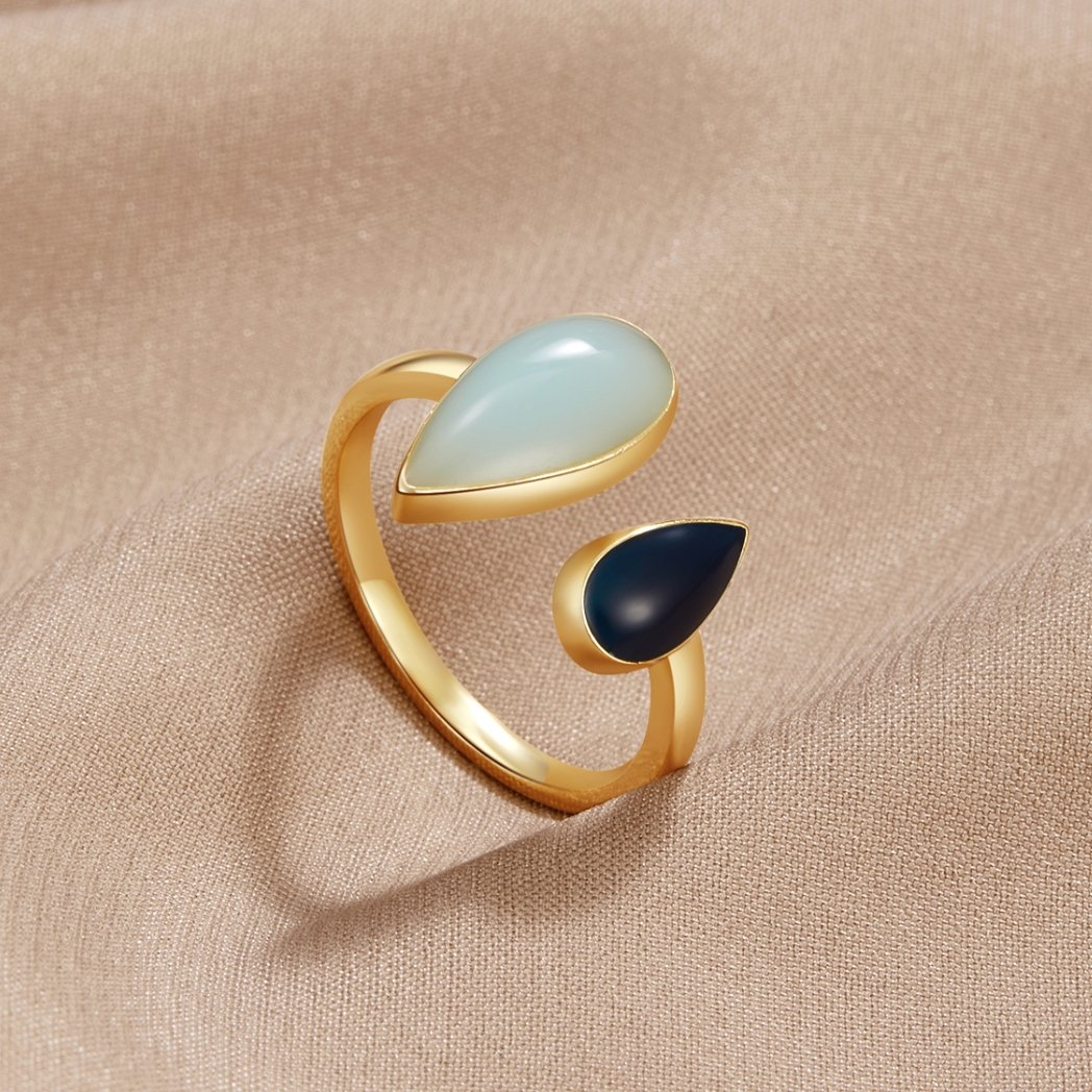 Aquamarine Teardrop Ring, gold open ring with pale blue and dark navy teardrop stones on beige