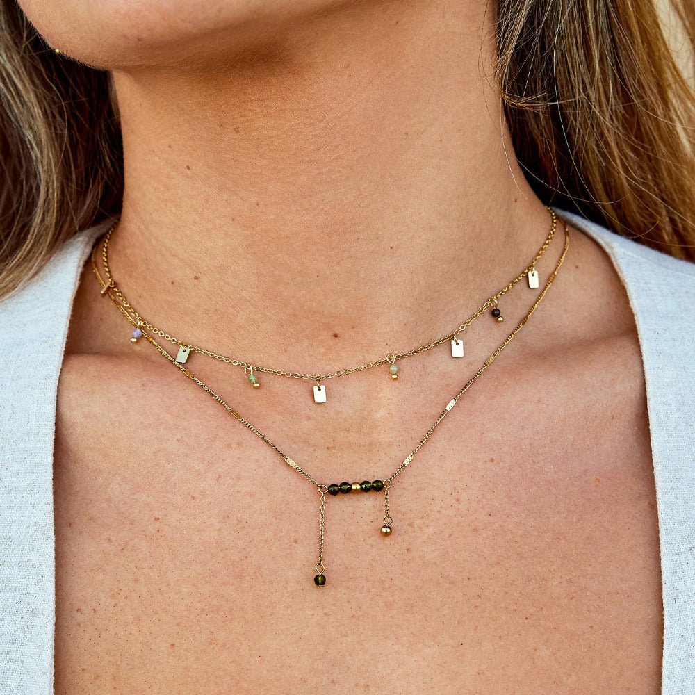 Arizona Green Bead Tassel Necklace, worn layered at the neck with gold chains and green beads
