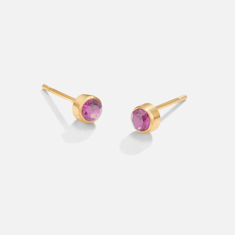 Birthstone Stud Earrings, pair of gold stud earrings with round pink gemstones, on white