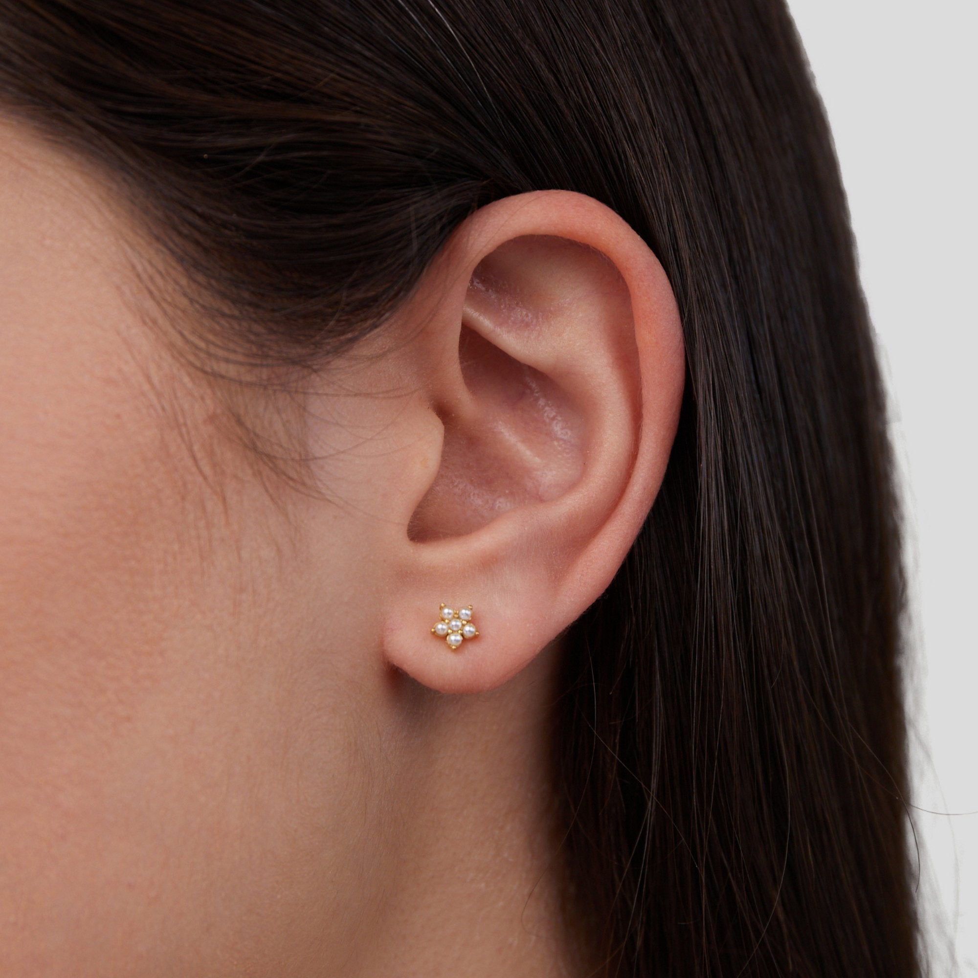 Blooming Flower Pearl Earrings, worn in an ear, small gold flower stud with pearls