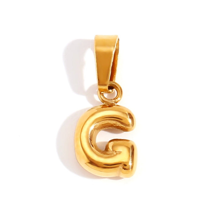 Bubble Letter Necklace, gold bubble-letter G pendant on a white background
