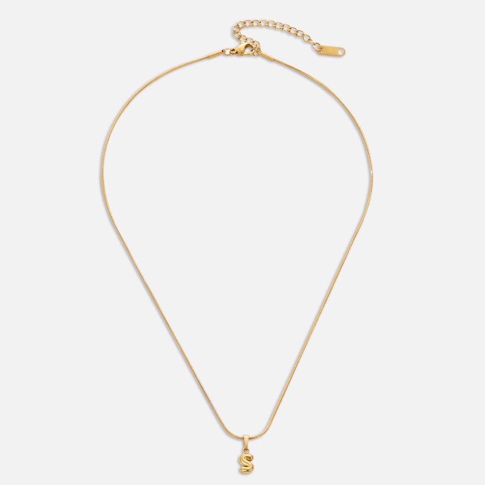 Bubble Letter Necklace, flat-lay of a thin gold chain with a bubble letter S pendant