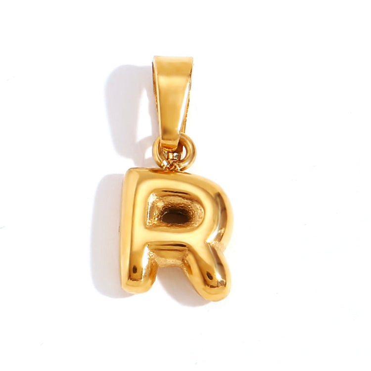 Bubble Letter Necklace, gold bubble-letter R pendant with a bail, on a white background