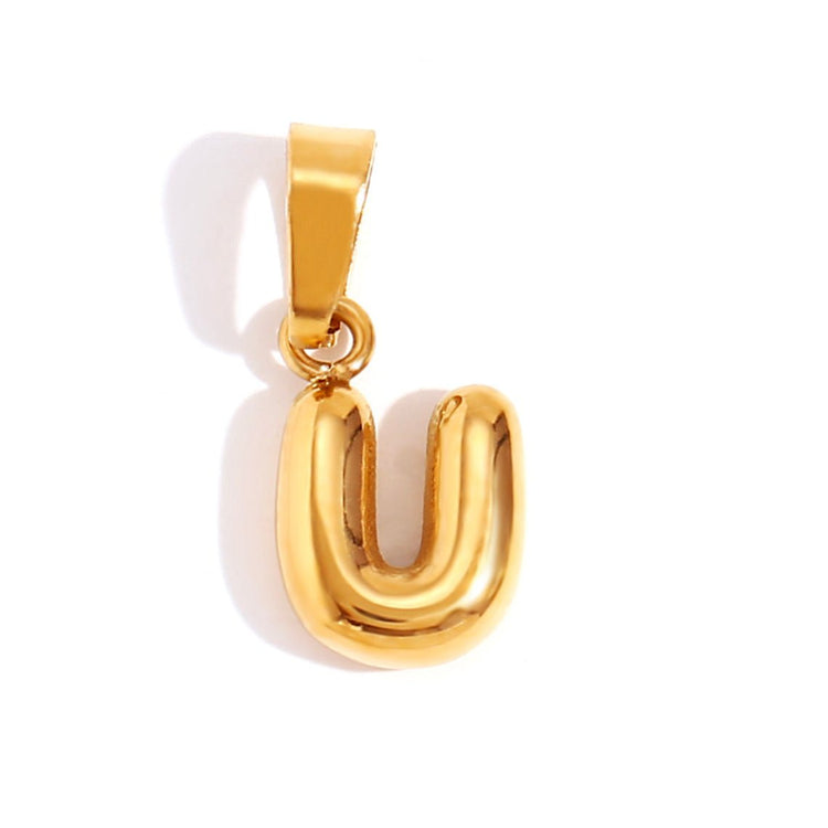 Bubble Letter Necklace, close-up of a glossy gold bubble letter U pendant on a white background