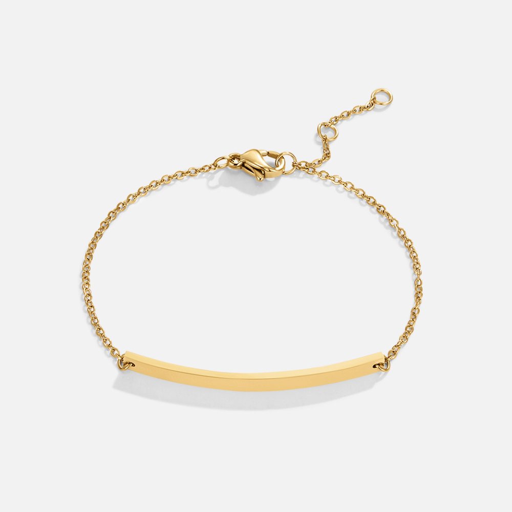 Cara Gold Bracelet, flat lay of gold chain bracelet with curved gold bar and lobster clasp