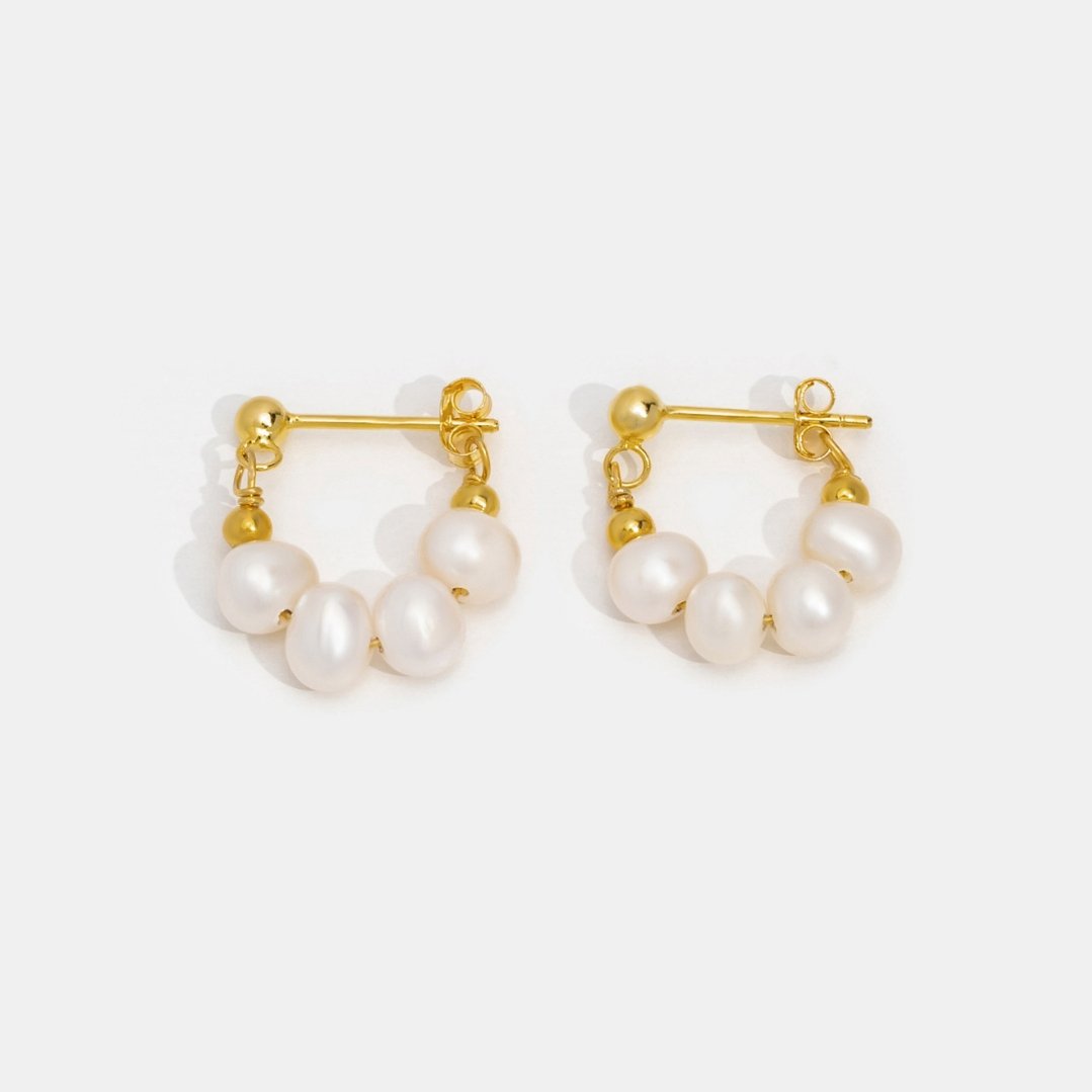 Celine Pearl Hoop Earrings, pair of gold hoop earrings with cream pearls, on white background