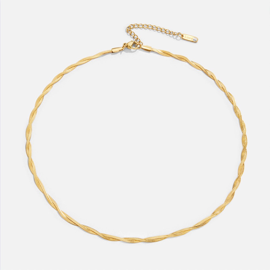Chiara Twist Snake Chain Necklace, laid flat on a light grey background, twisted gold chain