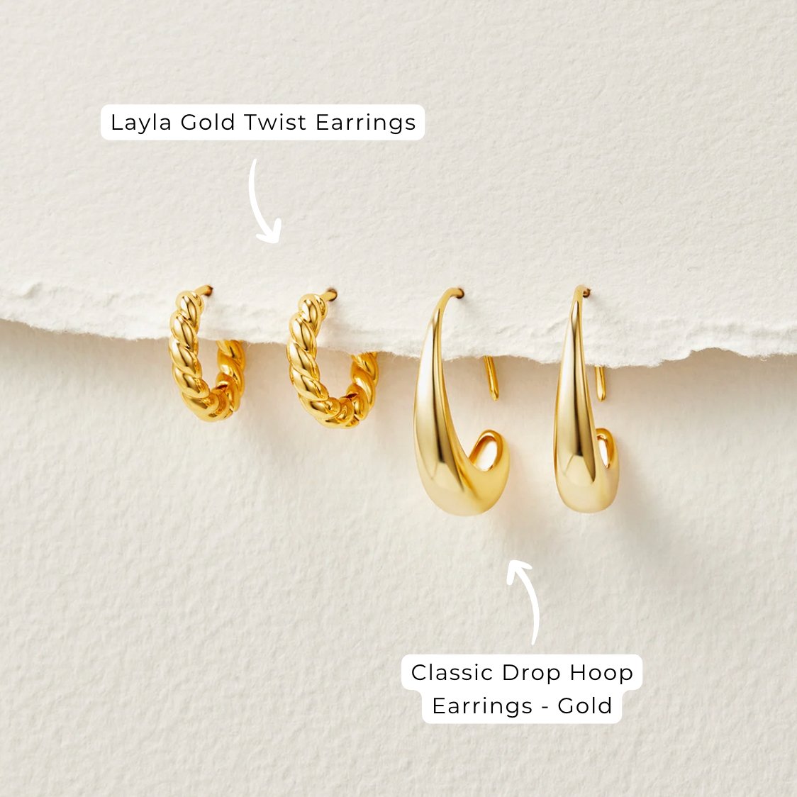 Classic Drop Hoop Earrings, two pairs of gold earrings side by side on textured paper, twisted hoops and smooth drops