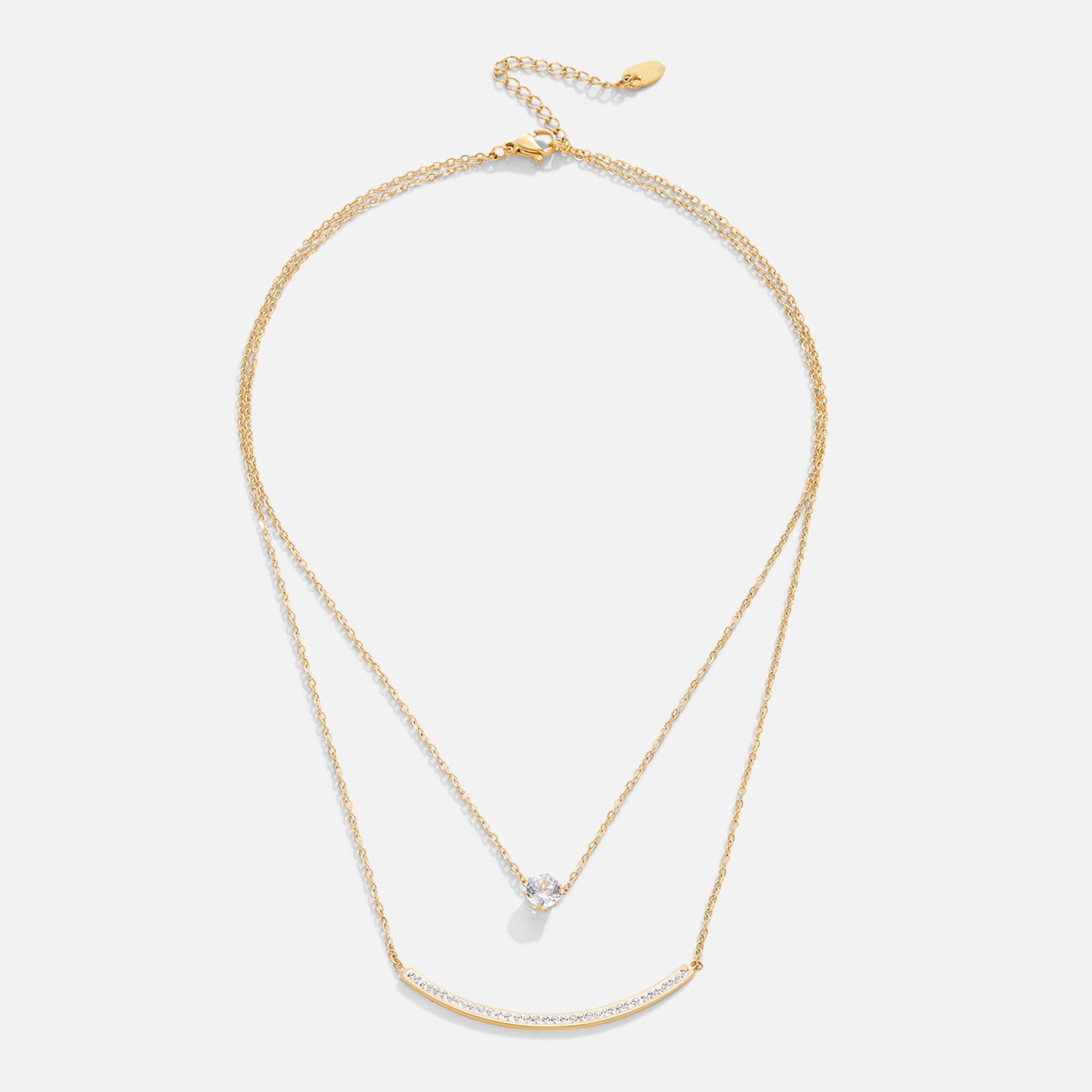 Dainty Crystal Layered Necklace, flat lay of two gold layered chains, one with a round