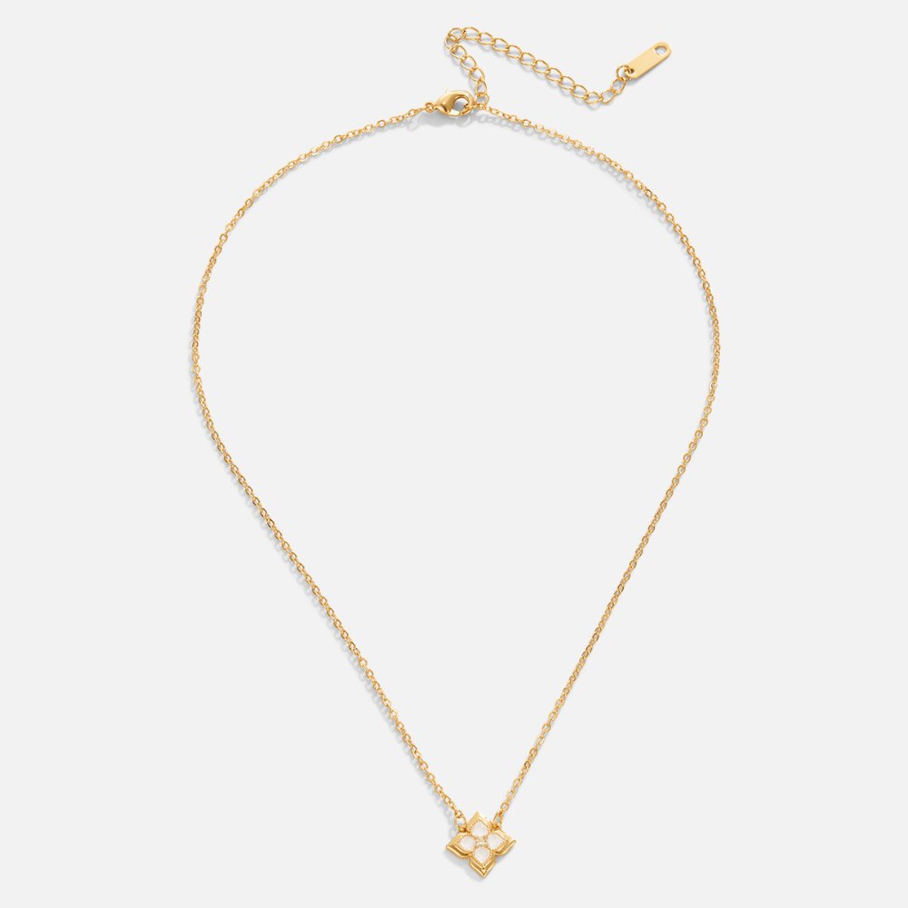 Dalia White Iris Clover Necklace, flat lay of gold chain with clover pendant set with white