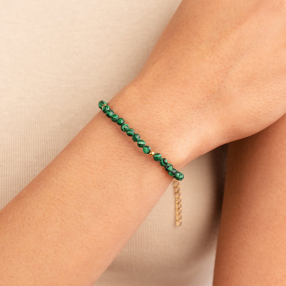 Emerald Green Beaded Bracelet, worn on a wrist with green beads and gold spacers