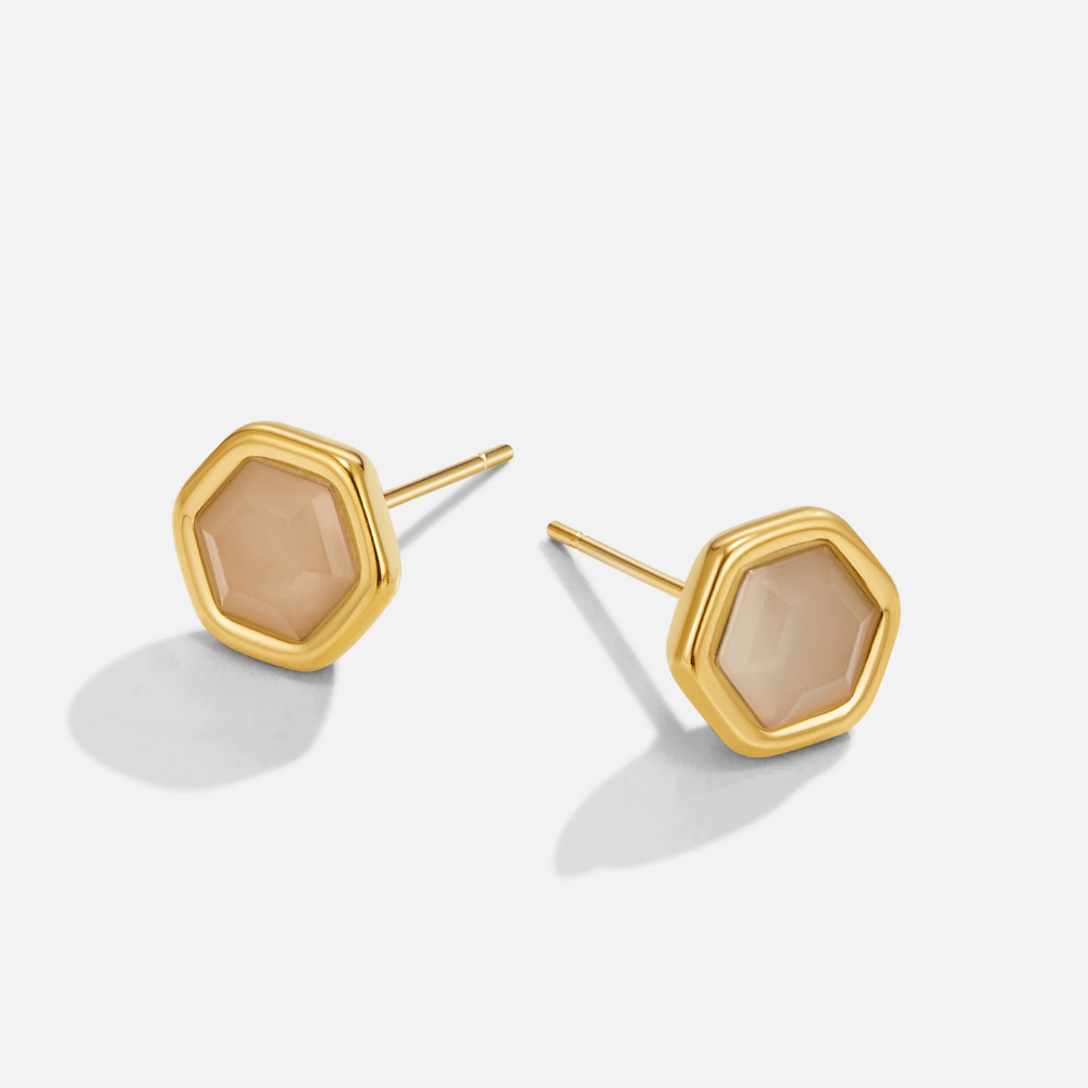 Eva Moonstone Stud Earrings, pair of gold hexagon studs with peach moonstone centres on white