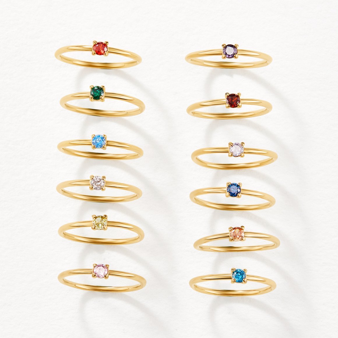 February Birthstone 18K Gold Ring, twelve thin gold rings in a grid, each with a different
