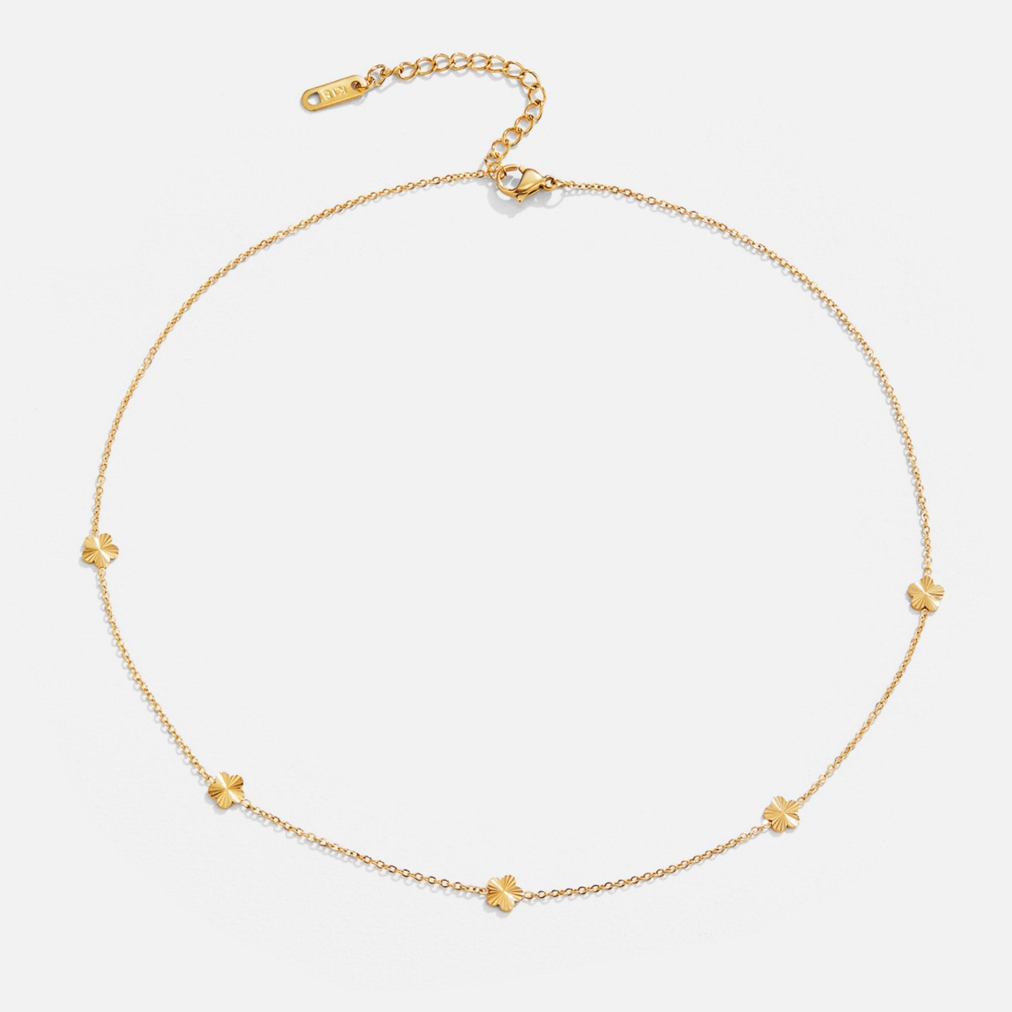 Flower Power 18K Gold Chain Necklace, flat lay of a thin gold chain with four-leaf clover
