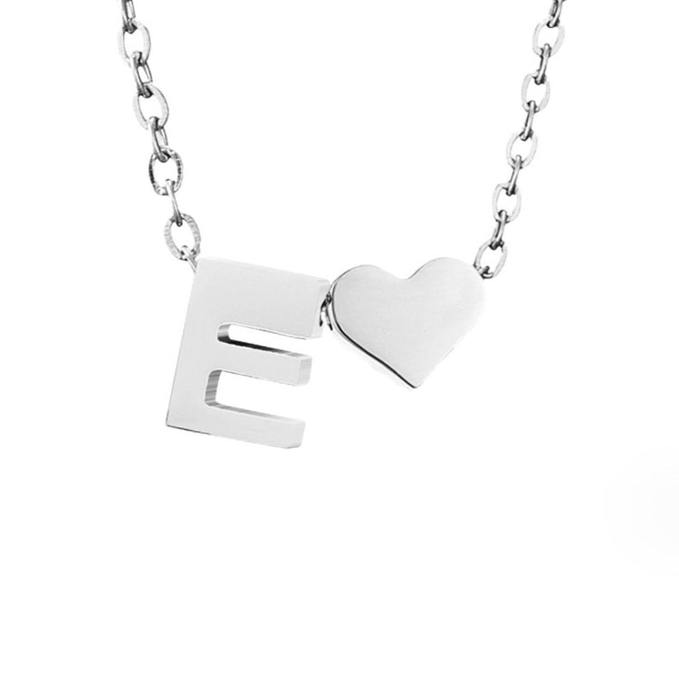 Forever Love & Letter Silver Necklace, close-up of silver letter E pendant beside a heart on a