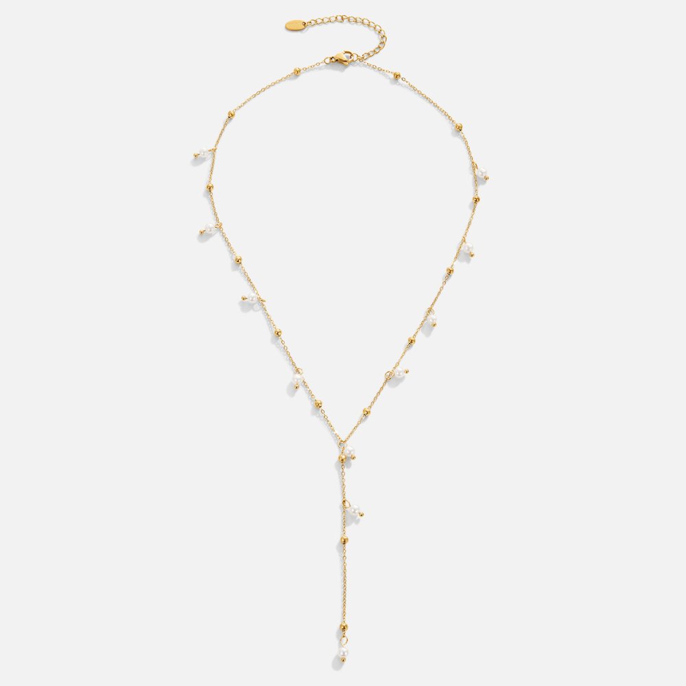 Lariat Pearl Drop Necklace, flat lay of gold chain with pearl drops in a lariat shape