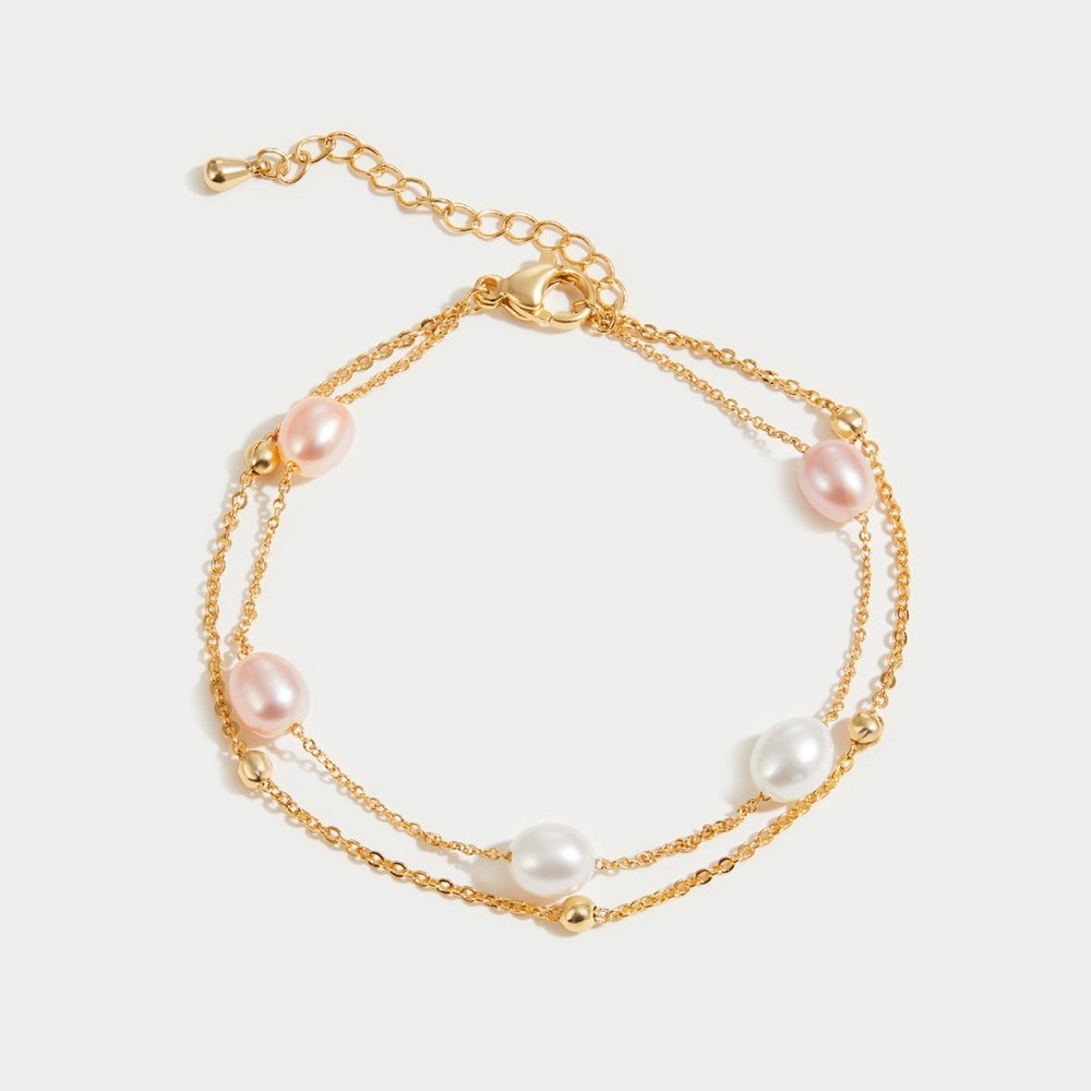 Freshwater Pearl Layered Bracelet, flat lay of a double gold chain with pink and white pearls