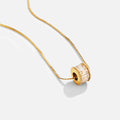 Gigi Crystal 18K Gold Necklace, gold chain threaded through a crystal-set barrel bead on white