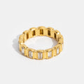 Gigi Square Crystal Ring, standing upright on white, gold band with rectangular clear stones