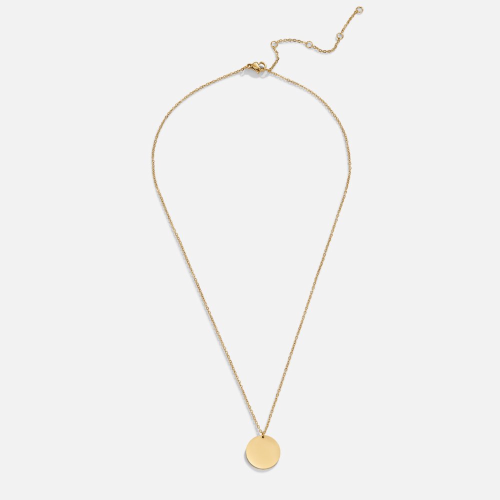Gold Coin Necklace, flat lay of a fine gold chain with a round disc pendant and extender