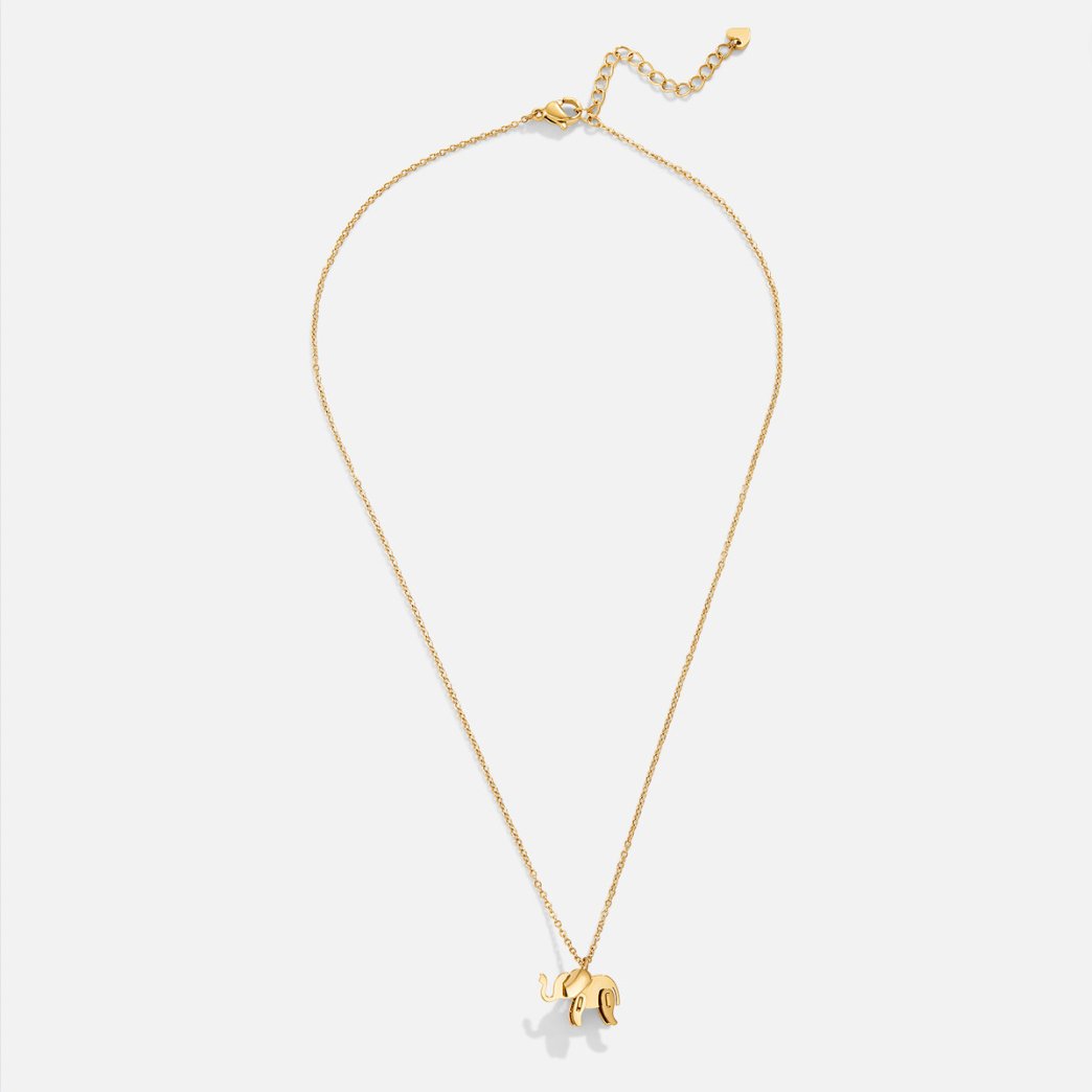Gold Elephant Necklace, flat lay of a fine gold chain with a small elephant pendant