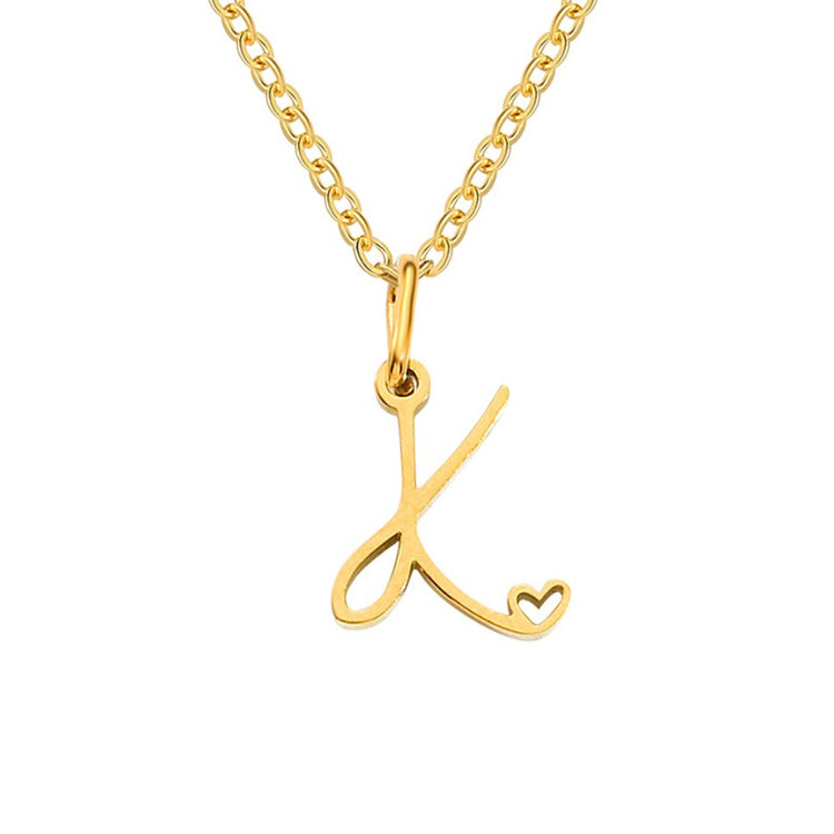 Gold Letter Heart Necklace, gold script letter pendant on a fine chain, white background