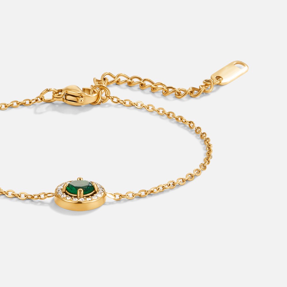 Green Emerald Crystal Bracelet, gold chain bracelet with green stone and clear halo, laid flat