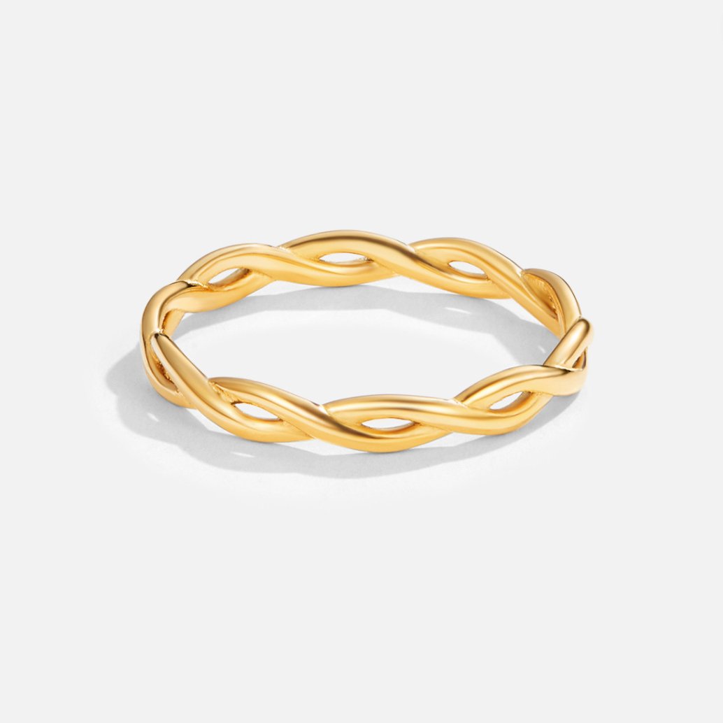 Infinity 18K Gold Twist Ring, standing alone on a plain white background, braided gold band
