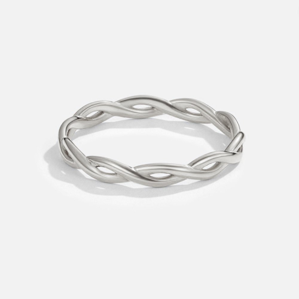 Infinity 18K Silver Twist Ring, standing alone on white background, polished twisted silver band