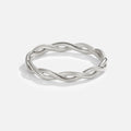 Infinity 18K Silver Twist Ring, standing alone on white background, polished twisted silver band