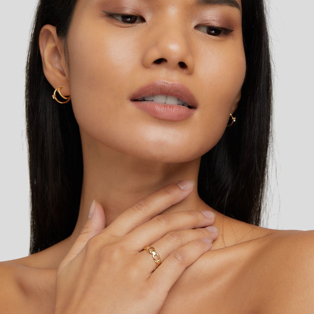 Isabella Chain Ring, worn on a hand at the neck, gold chain-link ring visible