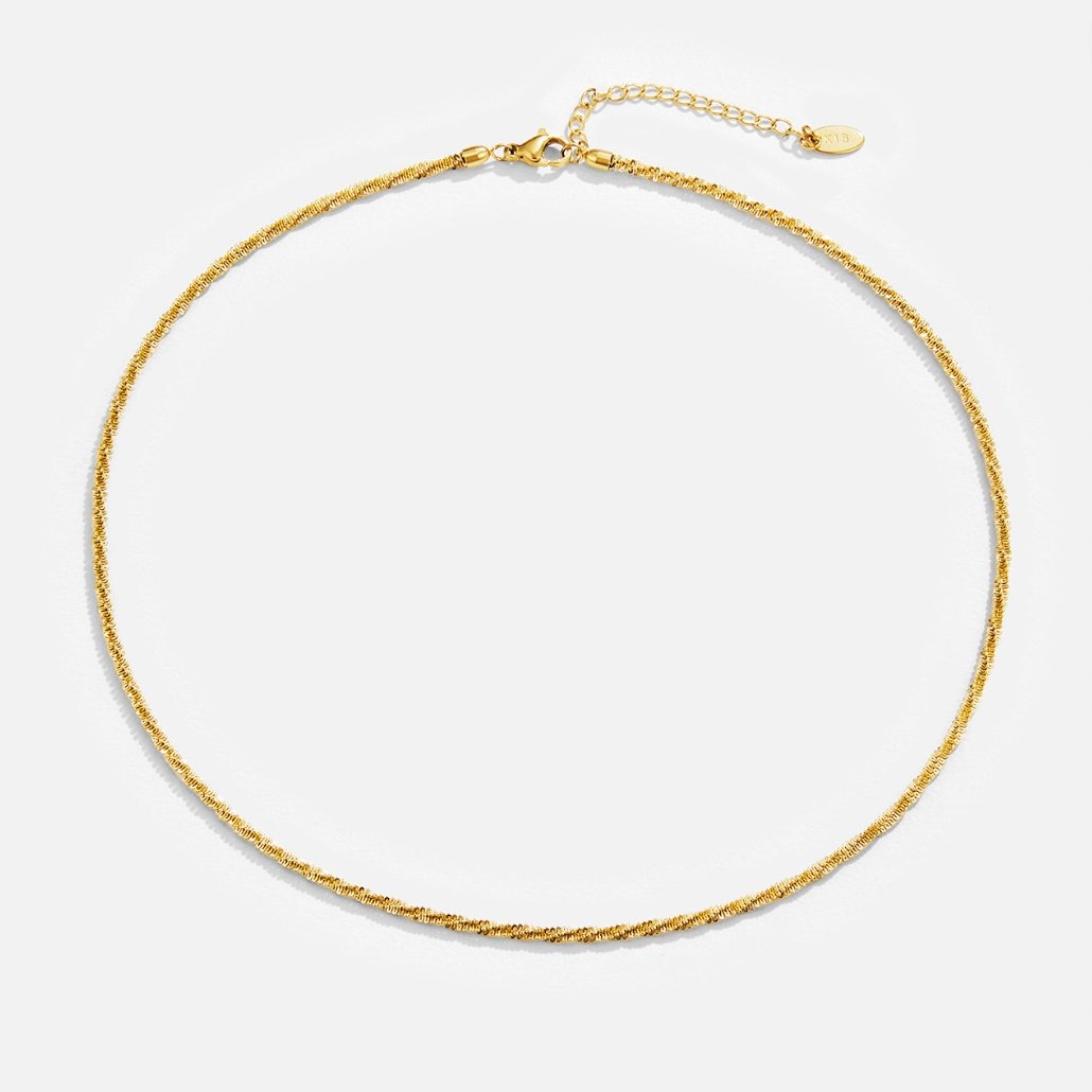 Kai 18K Gold Necklace, laid flat on a white background, with lobster clasp and extender chain