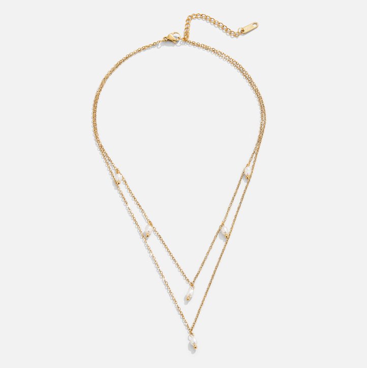 Kayla Pearl Drop Layered Necklace, laid flat on white, two gold chains with pearl drops