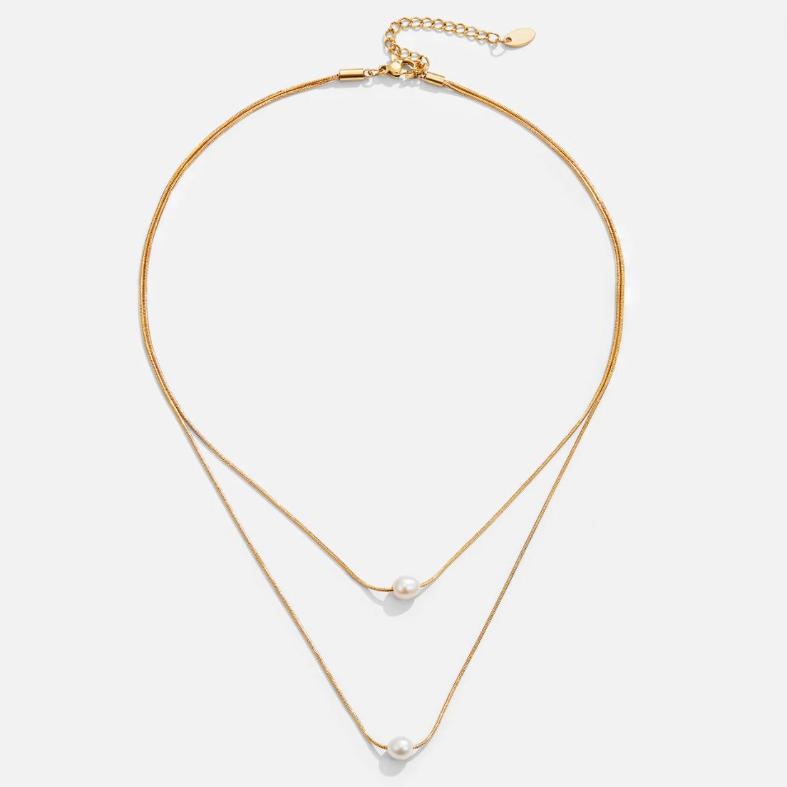 Layered Freshwater Pearl Necklace, flat lay of two gold chains with a pearl on each