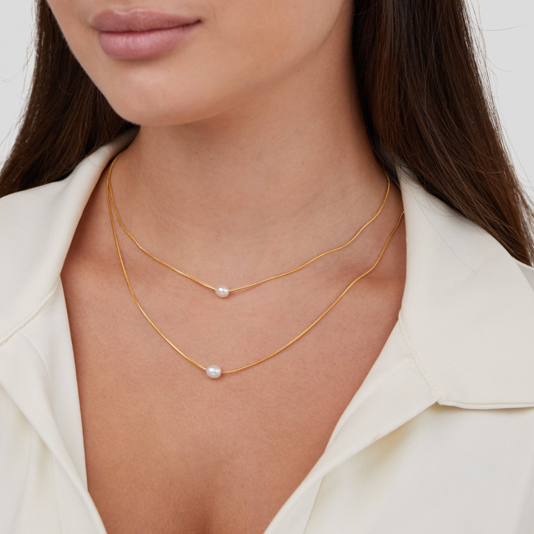 Layered Freshwater Pearl Necklace, worn layered on a neck with a white collared blouse