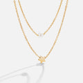 Layered Gold Star & Pearl Necklace, two gold chains layered, one with a pearl, one with a star