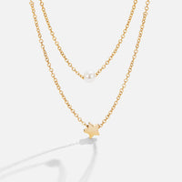 Layered Gold Star & Pearl Necklace, two gold chains layered, one with a pearl, one with a star