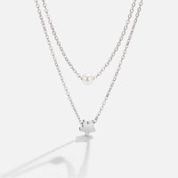 Layered Silver Star & Pearl Necklace, two silver chains layered, a pearl and a star pendant on