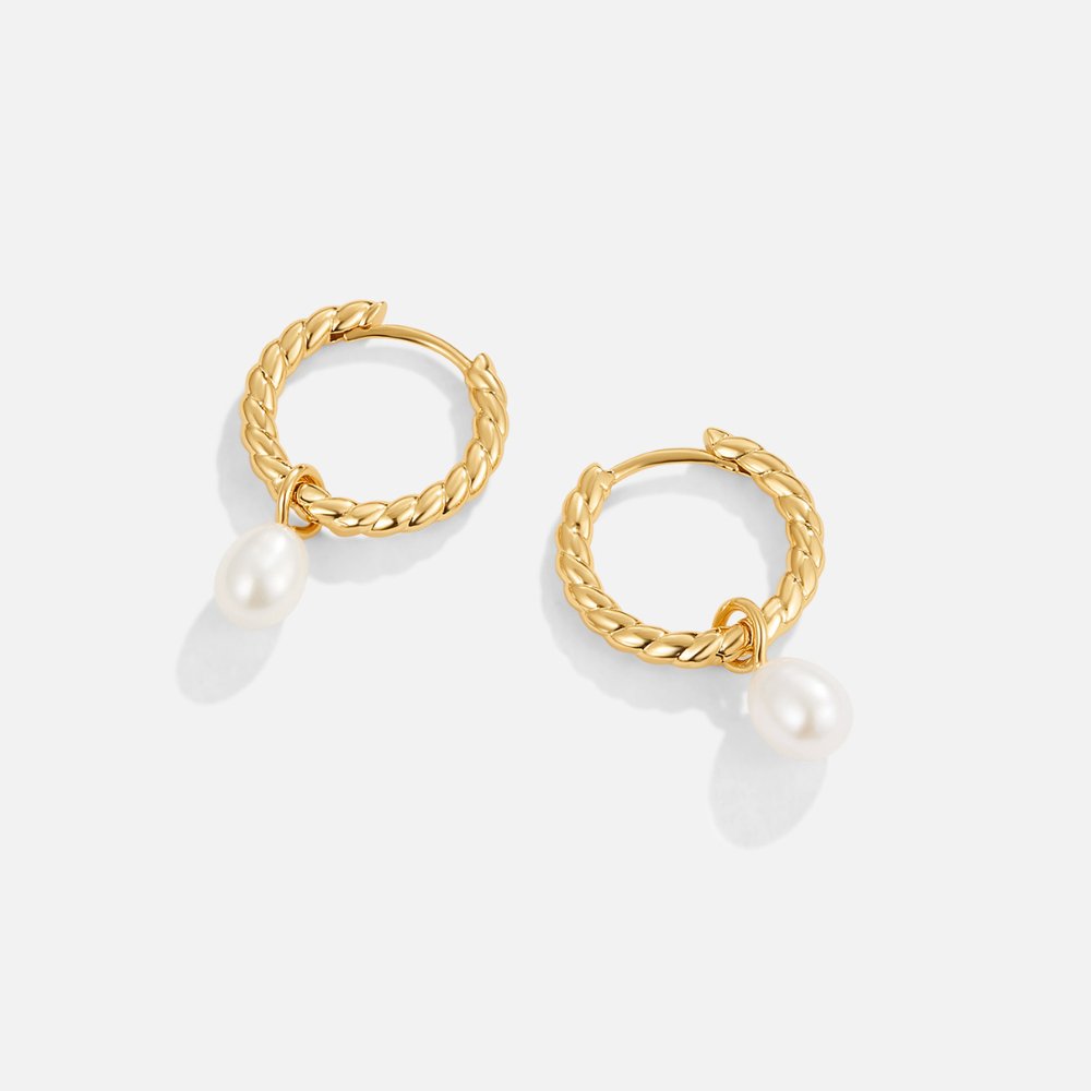 Layla Pearl Twist Earrings, pair of twisted gold hoops with dangling pearls on white